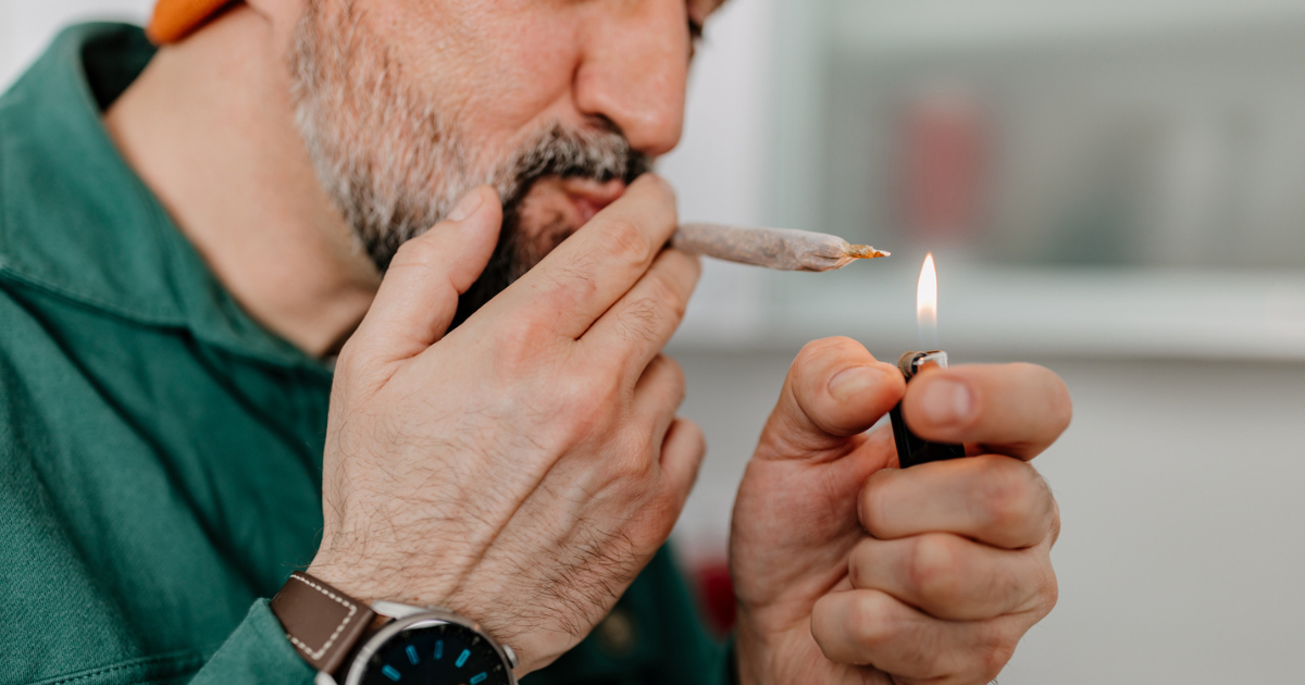 Close up of man smoking marijuana
