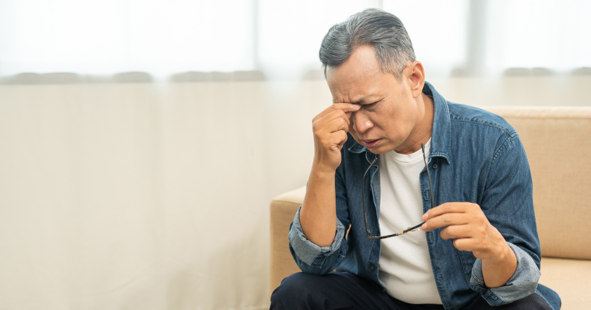 Man holding his head in pain