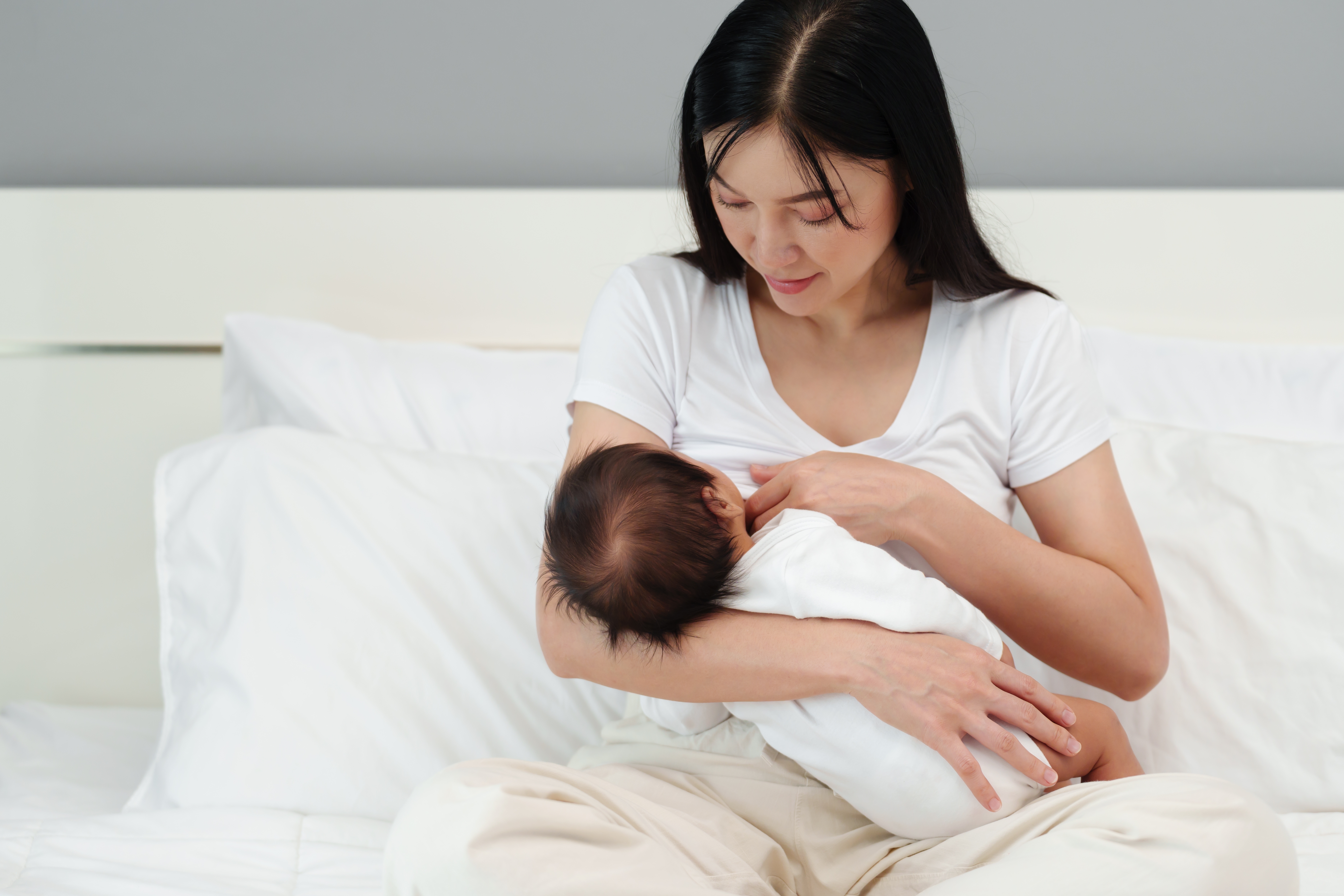 young mother nursing baby