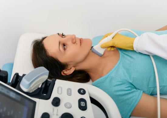 Woman getting ultrasound on neck