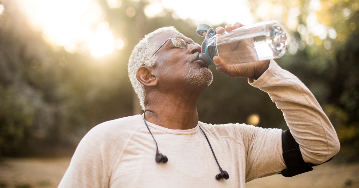 Older man drinking water