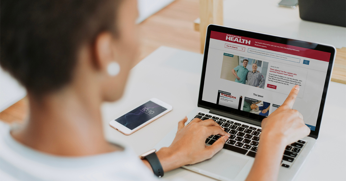 Woman looking at NebraskaMed.com on laptop