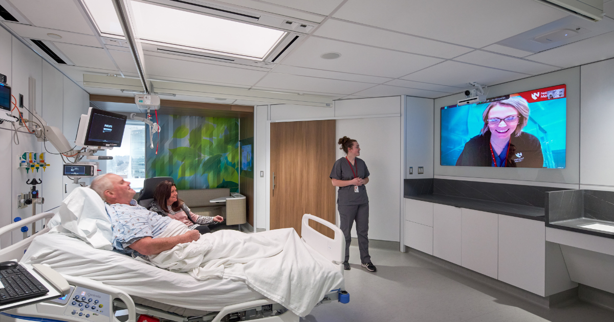 A remote nurse working with a bedside care team in the Innovation Design Unit