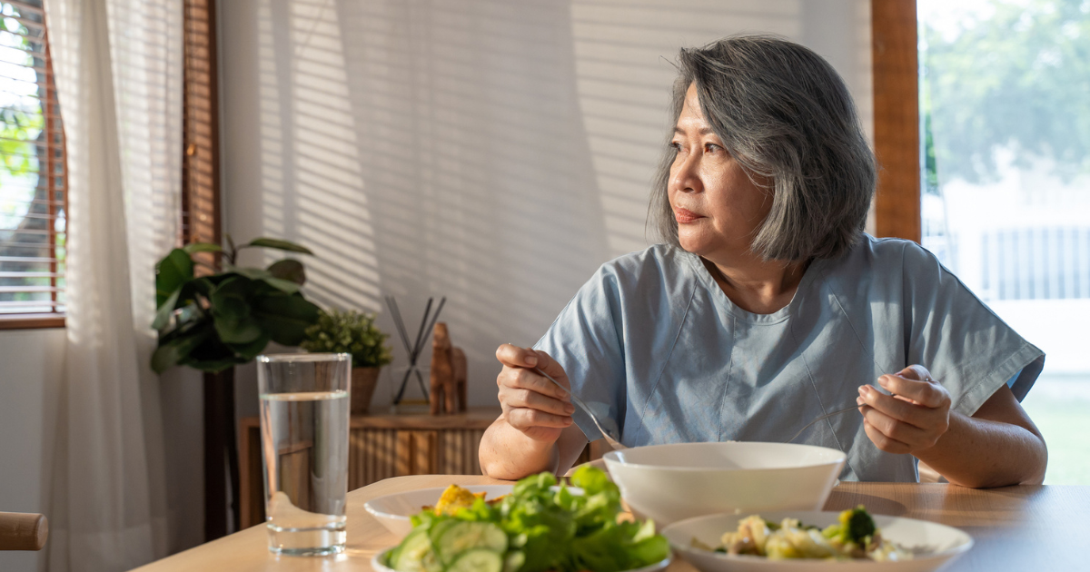 Woman eating alone