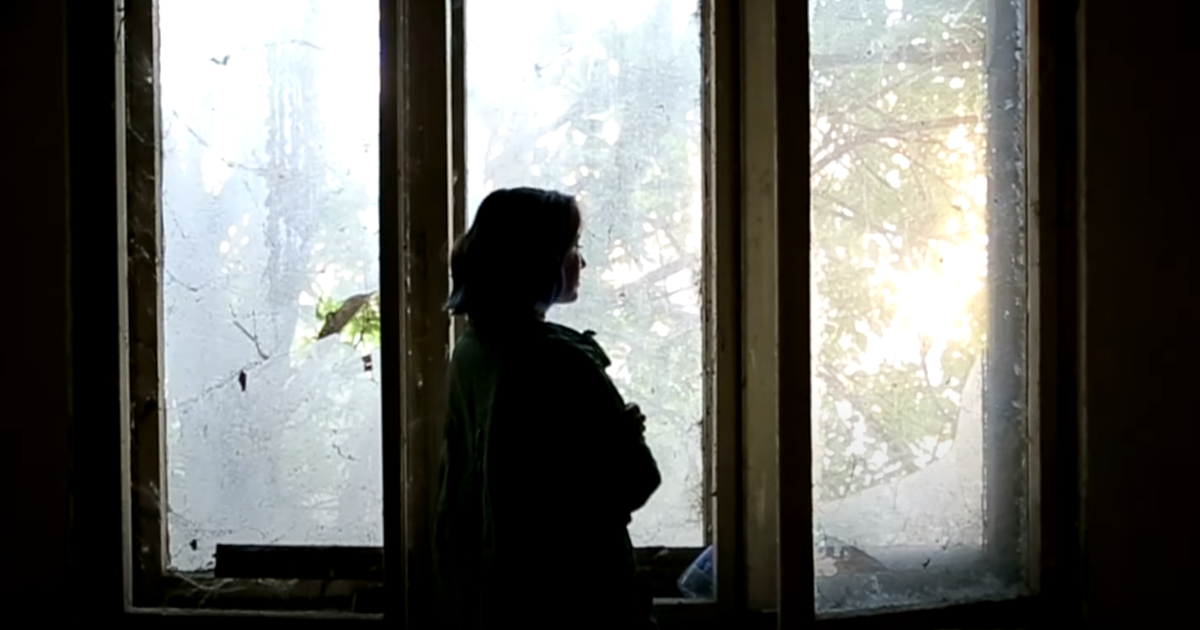 Woman looking out a window