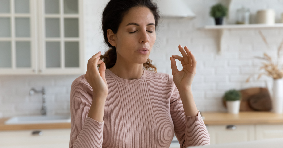 Woman doing calming breath