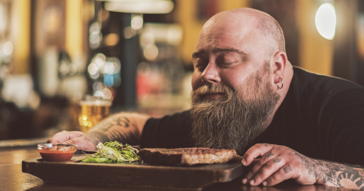 Man smelling a steak