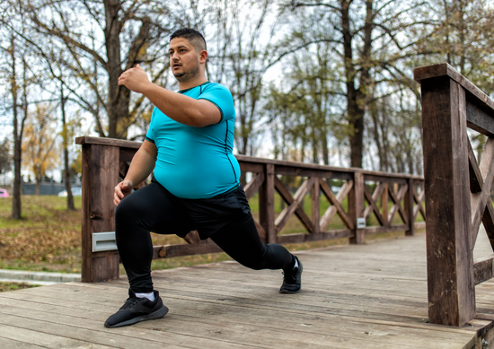 A picture of a man exercising on a bridge