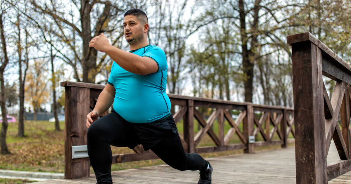 A picture of a man exercising on a bridge