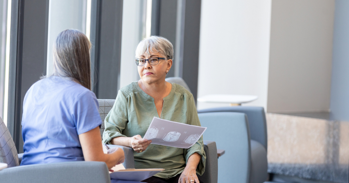 Doctor showing woman brain scans