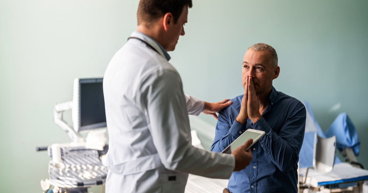 Man talking to doctor