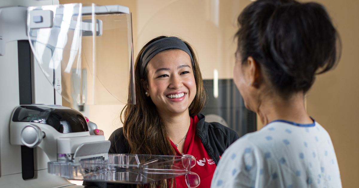 Woman talking to Nebraska Medicine mammographer