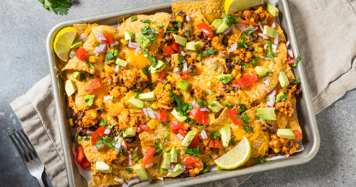 Homemade Vegan Loaded Sheet Pan Nachos with Tomato Cilantro and Lime