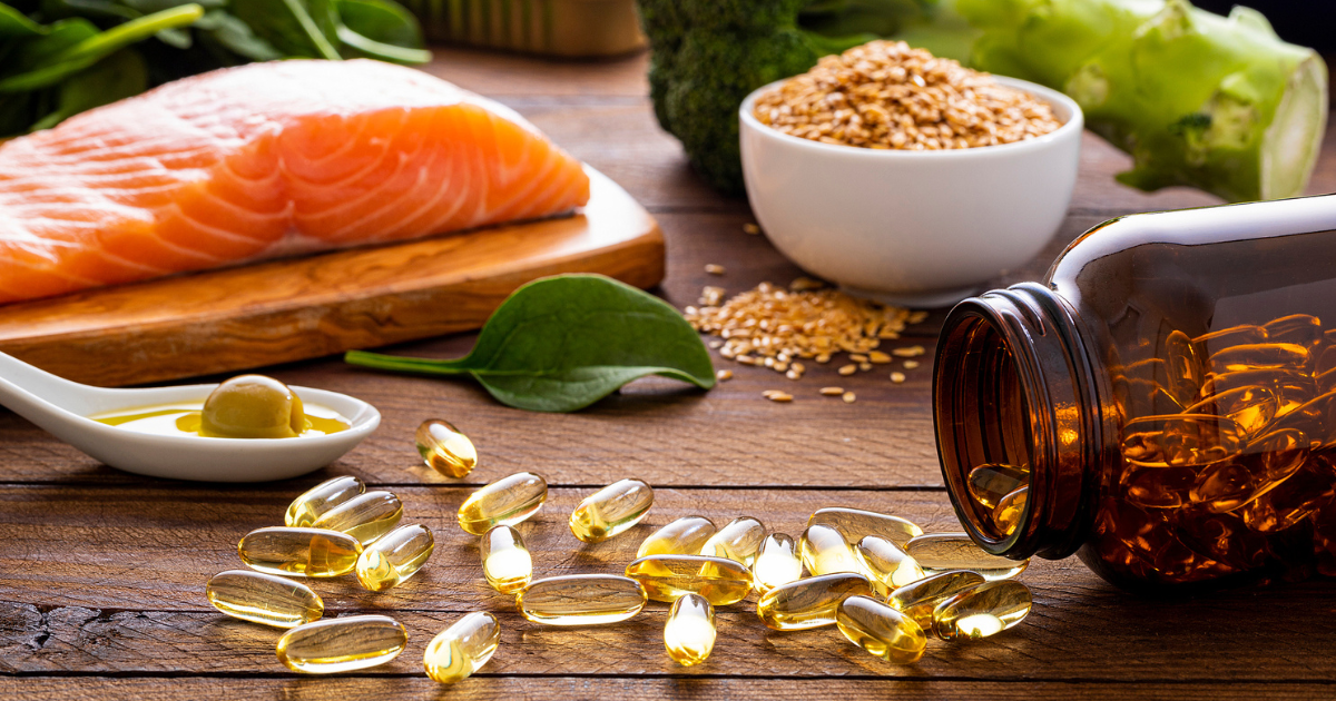 Fish oil pills on table with foods high in omega-3's