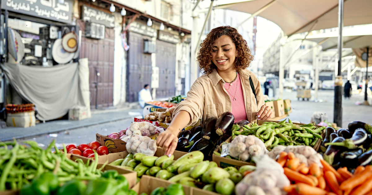 Woman selecting produce at the farmer's market