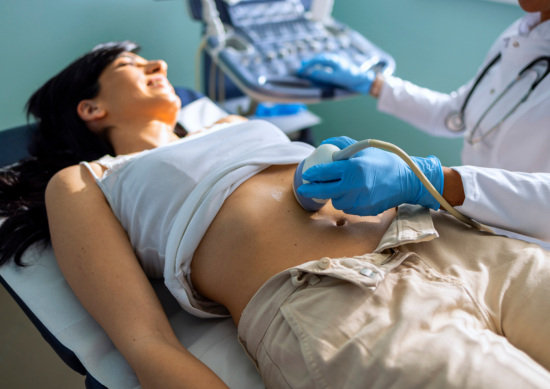 Woman receiving an ultrasound on her stomach