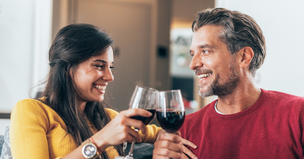 Man and woman drinking red wine