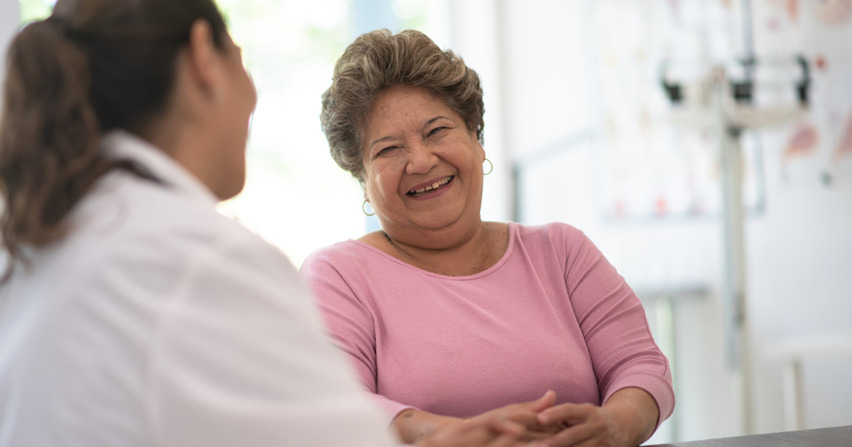 Middle-aged woman speaking to her doctor