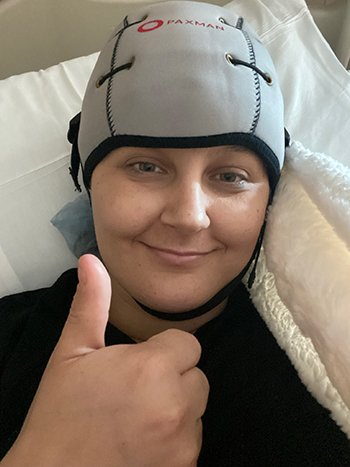 Chelsea wearing the Paxman scalp cooling cap.