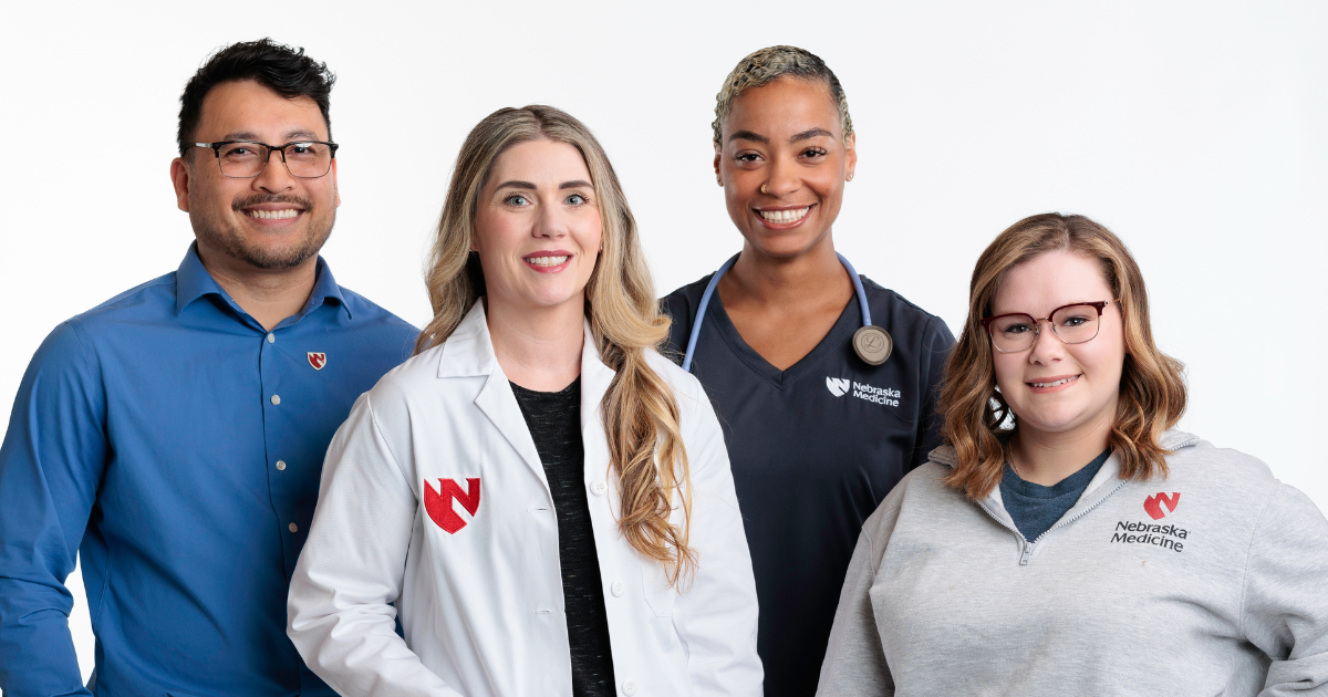 Four Nebraska Medicine employees standing together
