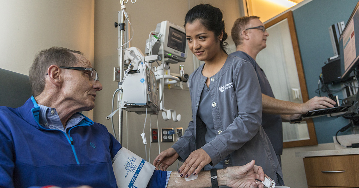 Nebraska Medicine nurse tending to patient