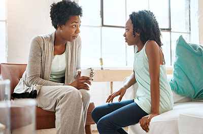 Image of a mom and daughter talking