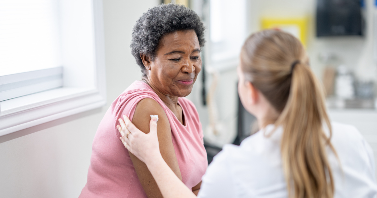 Older woman getting a shot