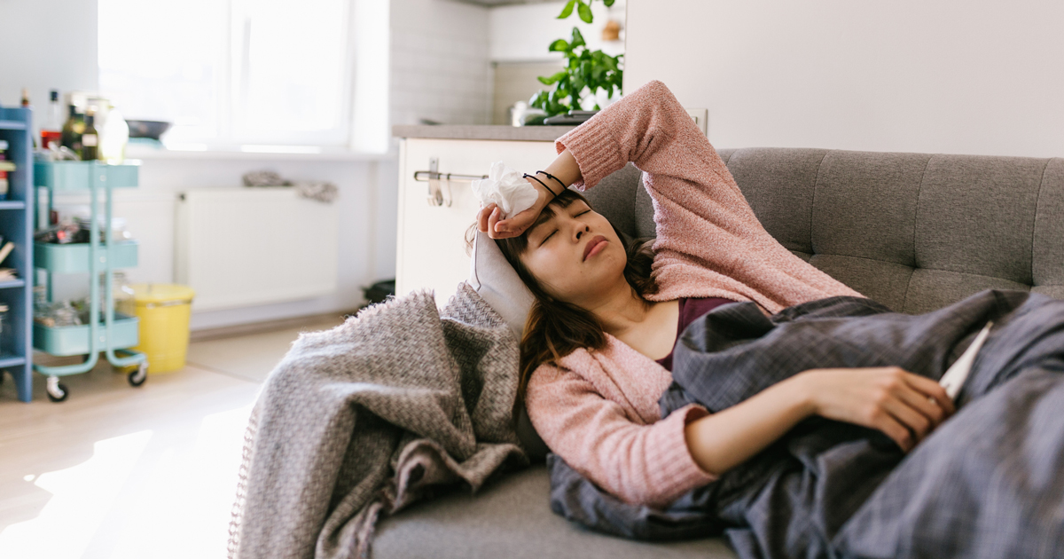 Woman sick on the couch