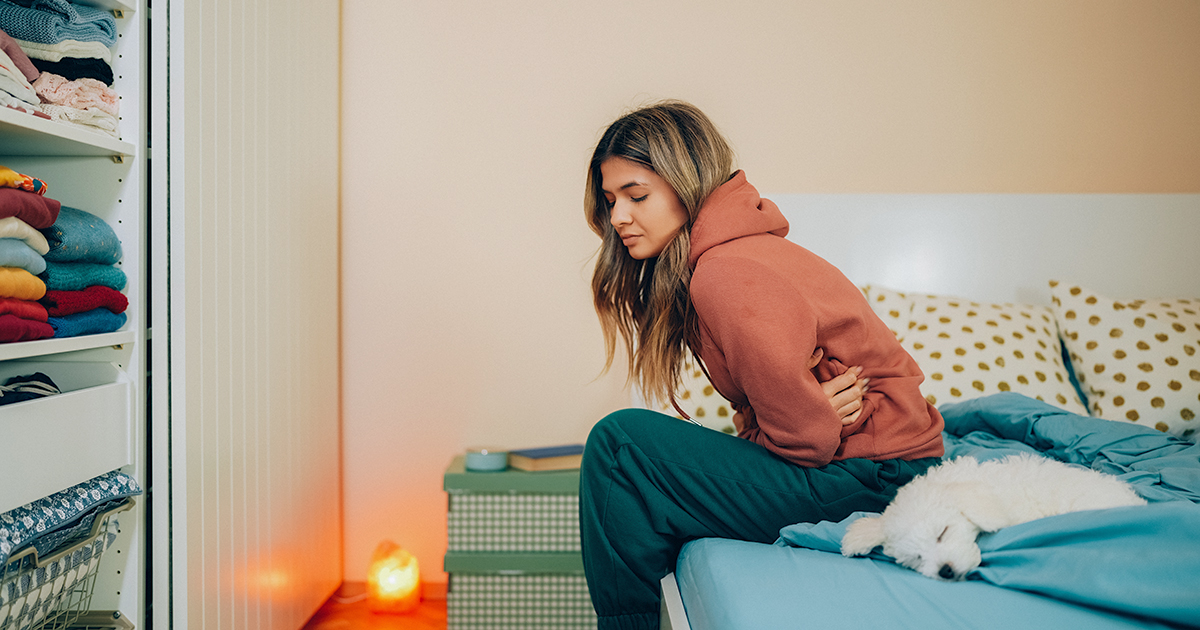 picture of a woman sitting on her bed