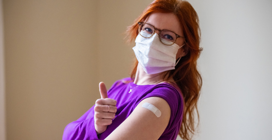 picture of a woman after getting her COVID-19 vaccine