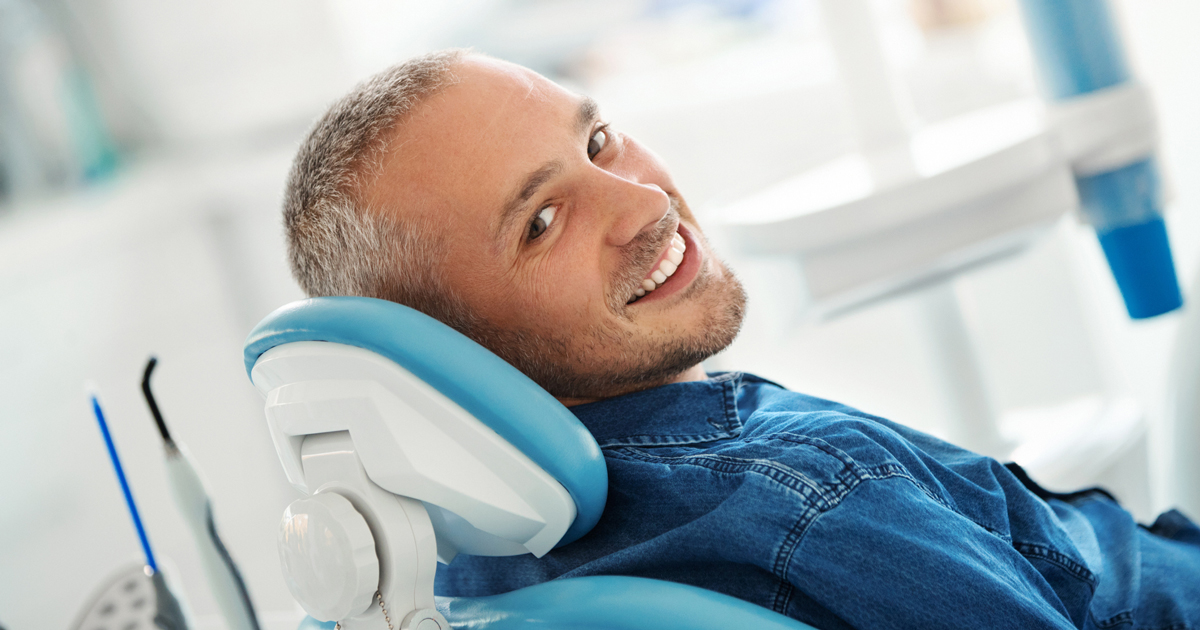 Man smiling in a dental chair