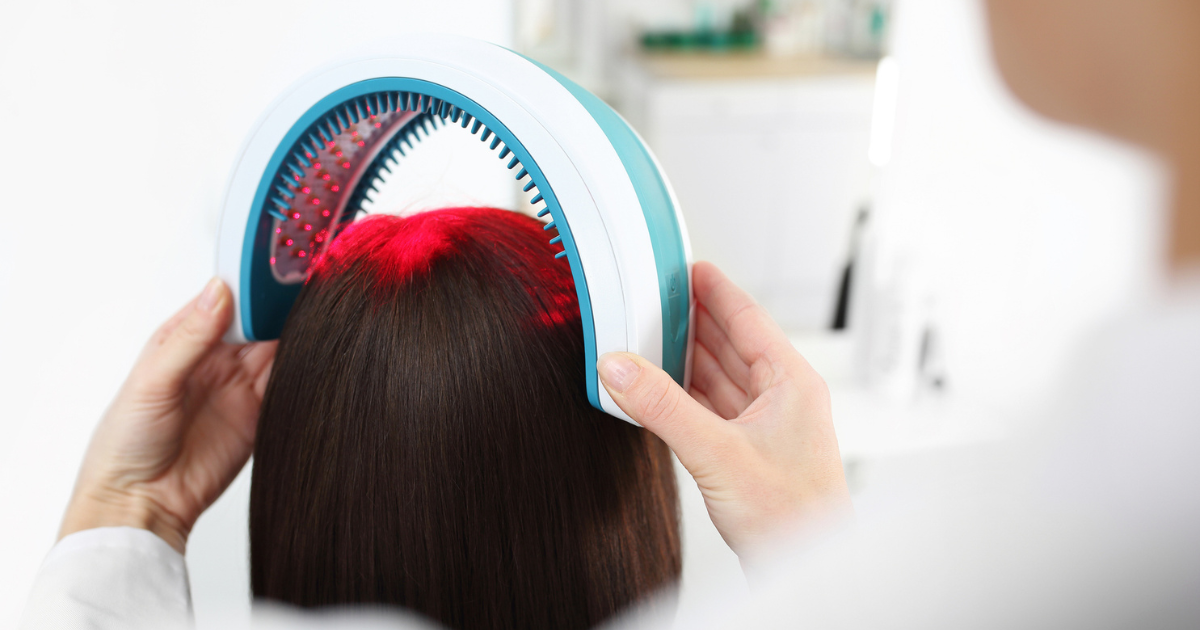 Provider using laser band on woman's head