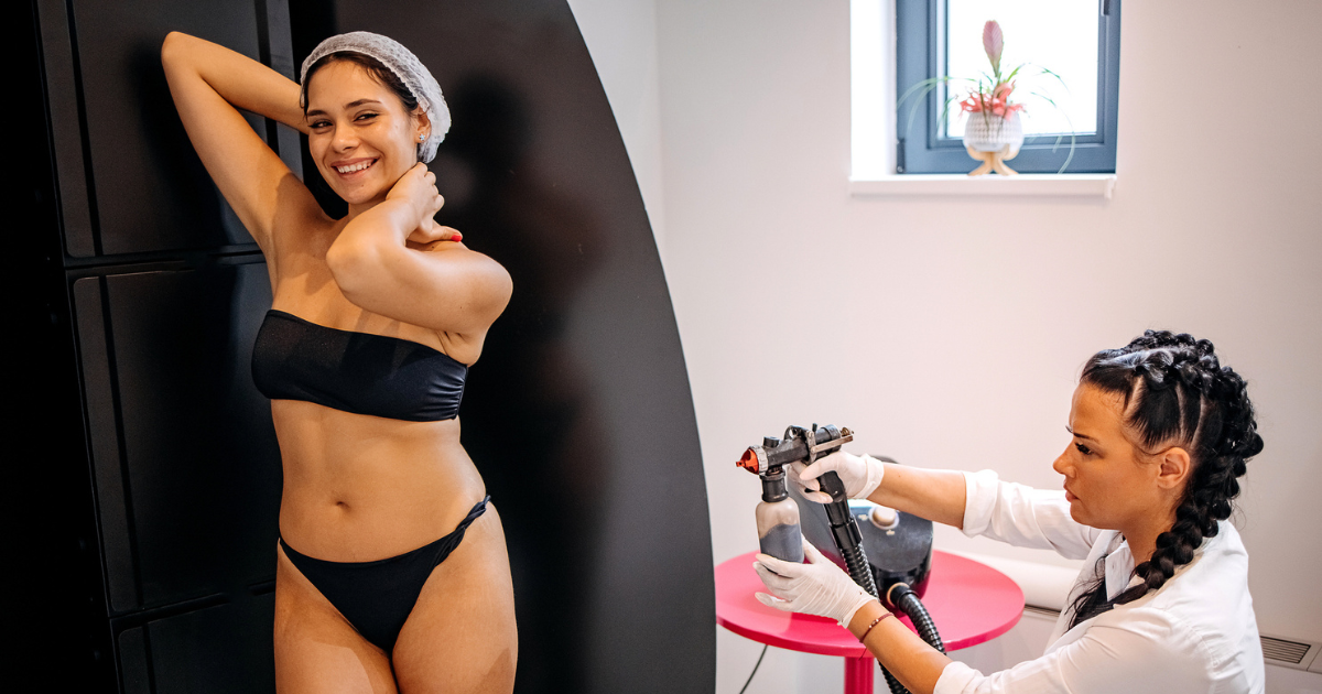 Woman getting spray tan