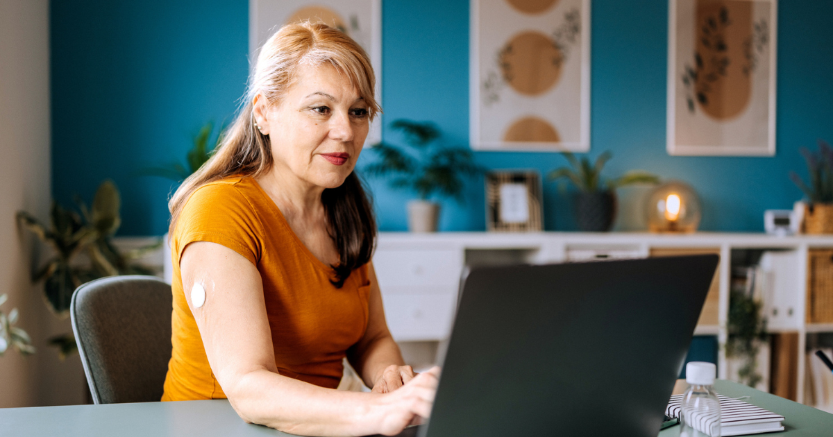 Diabetic woman looking at laptop
