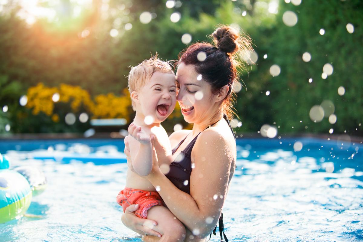 Mother and son in a pool
