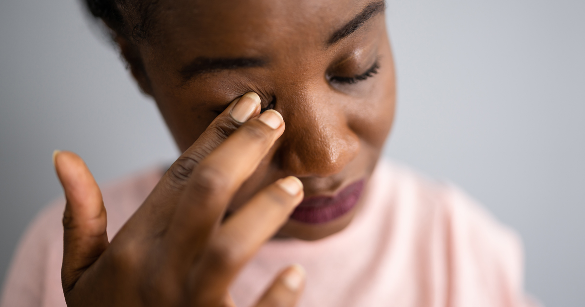 Girl rubbing her eye