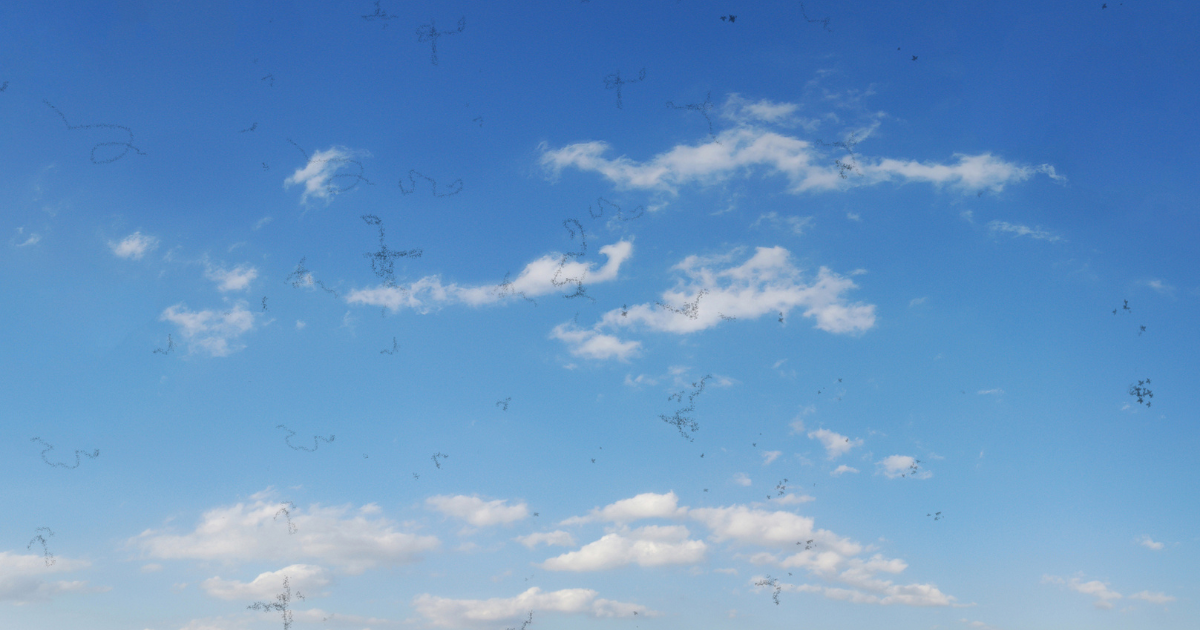 Simulated eye floaters over a cloudy blue sky