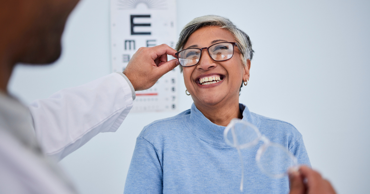 Older woman trying on eyeglasses