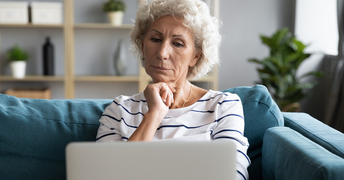 Older woman looking at laptop