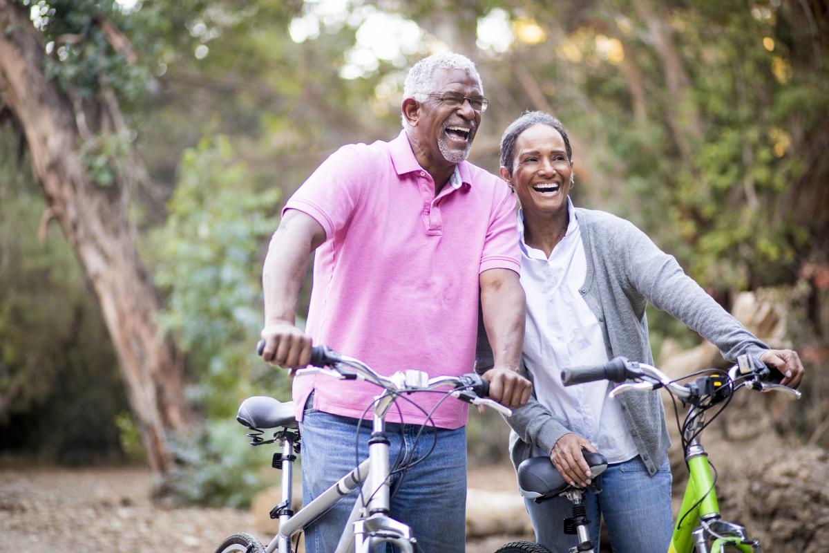 picture of a man and woman biking outdoors