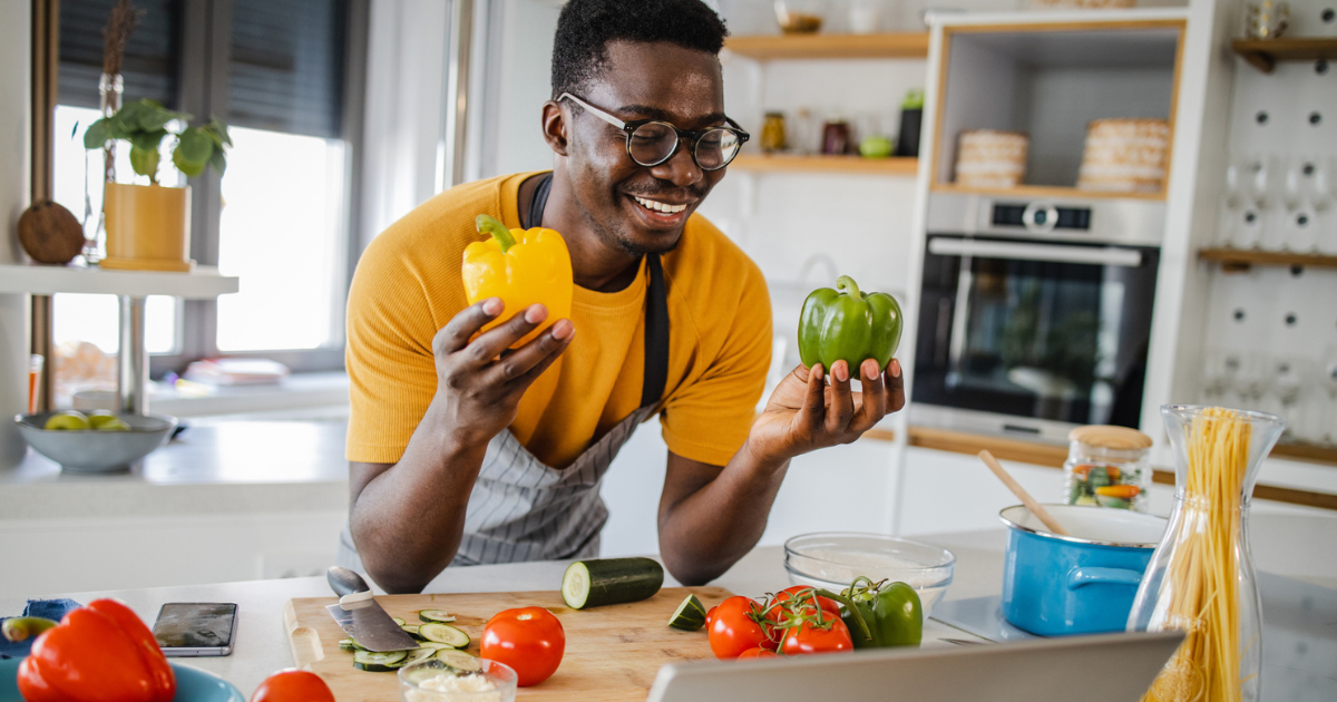 Man holding bell peppers