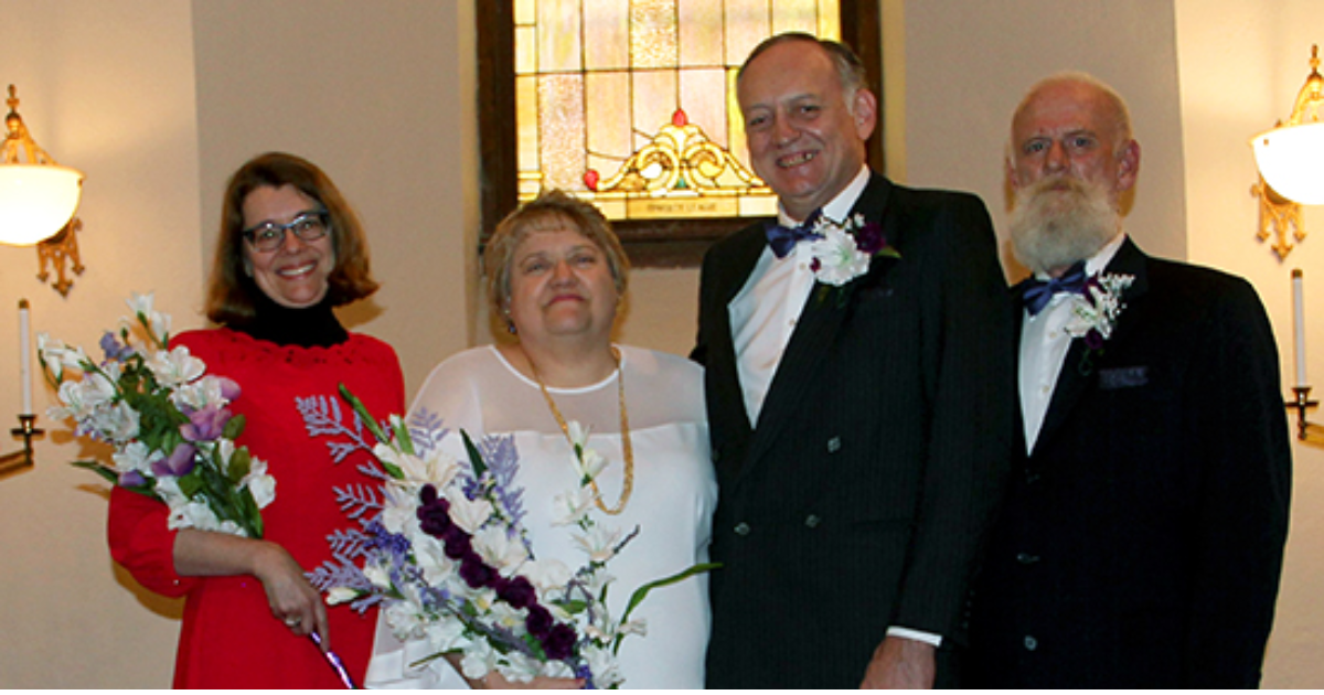 Lori Wiser and Dave Dyas with their wedding party, Julie Ostendorf (left) and Greg Solt (right).