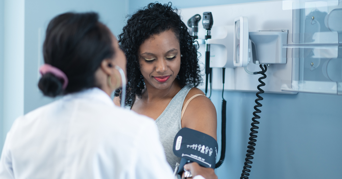 Woman getting her blood pressure taken