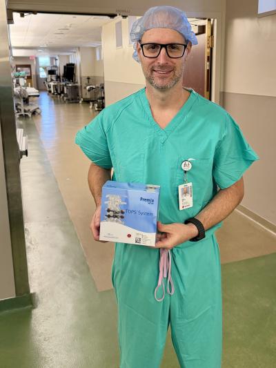 Dr. Katzir holding the TOPS system