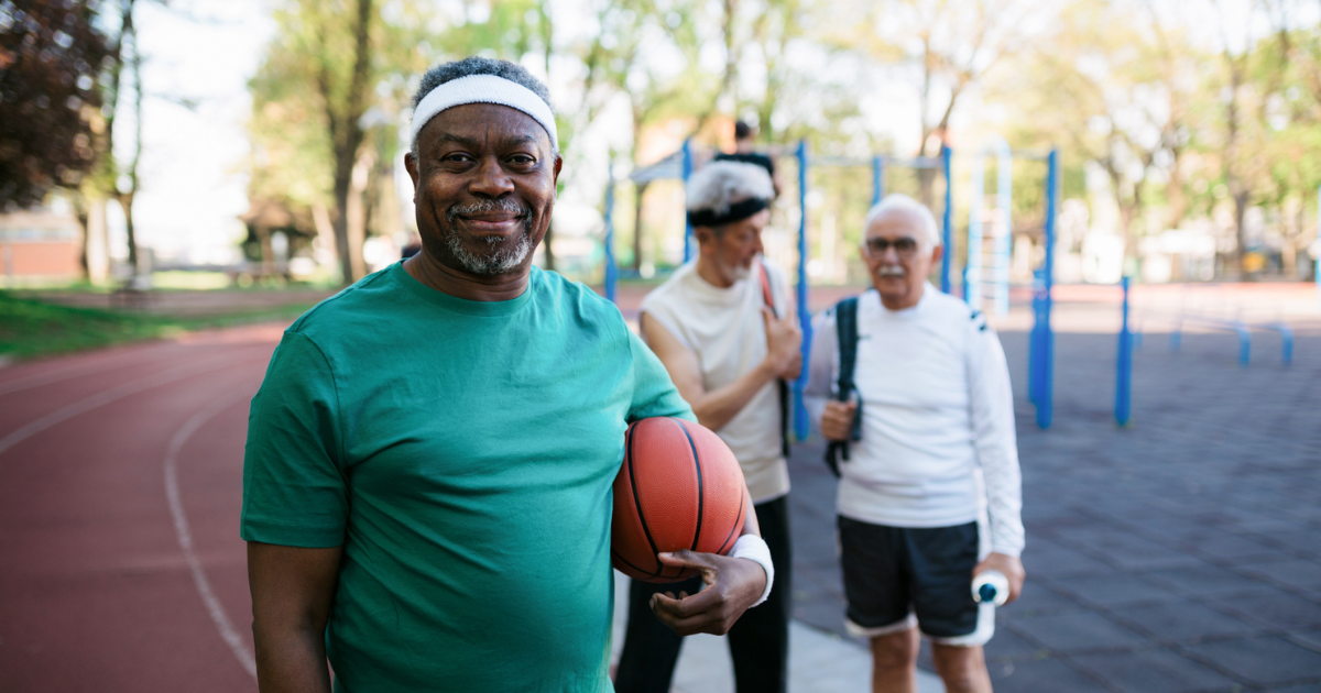 Older man holding a basketball