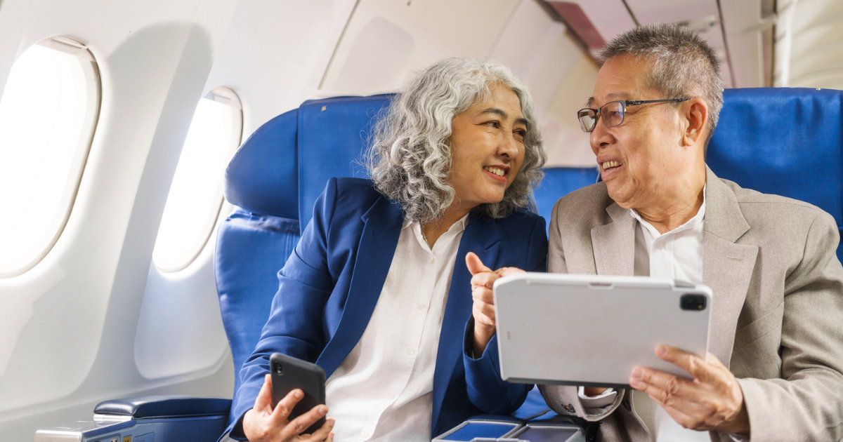 Man and woman sitting in airplane