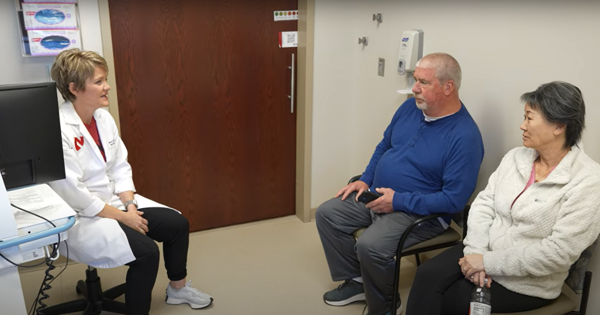 Patient Mindy Godwin and husband talking to Nebraska Medicine doctor