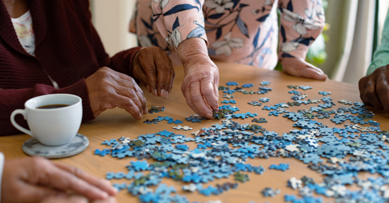 picture of women putting together a jigsaw puzzle