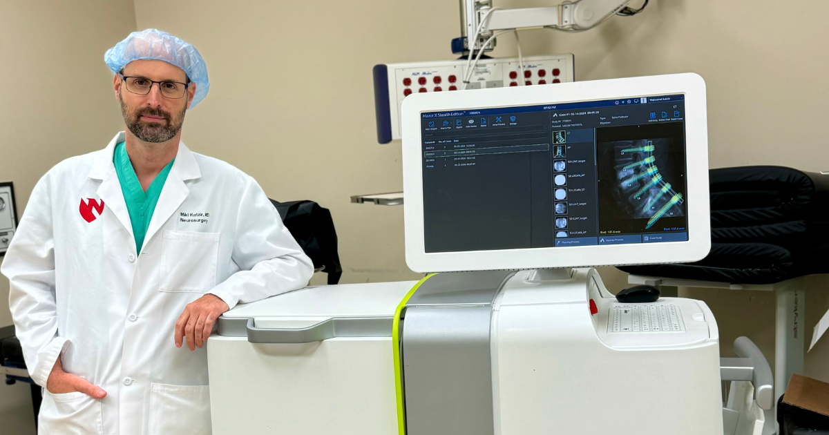 Dr. Katzir showing image of carbon fiber spine implant