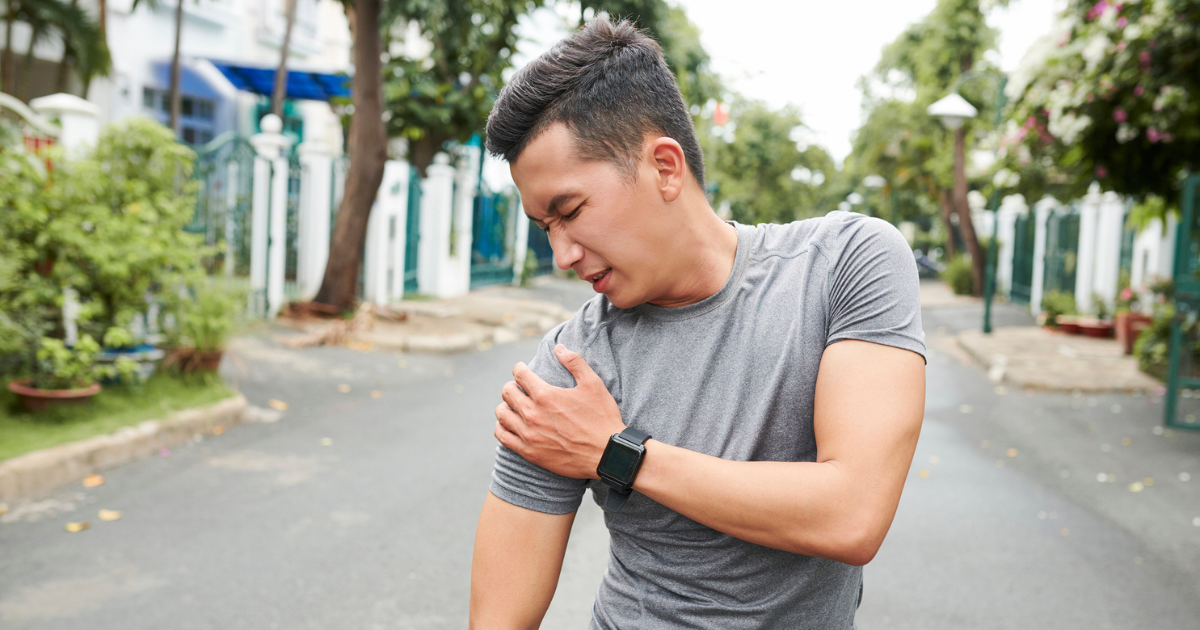 Man holding his shoulder in pain